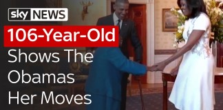 106-year-old Virginia McLaurin walks into the White House, yells 'Hi!' to President Obama, opening her arms wide with excitement as he comes over and takes her hands.